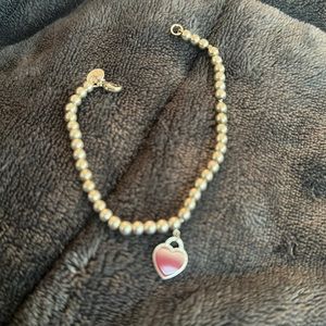 Authentic Tiffany and co red bead bracelet in silver